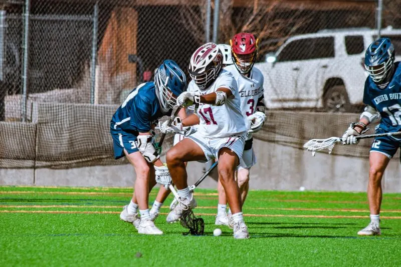 Lacrosse players scrambling for a ground ball